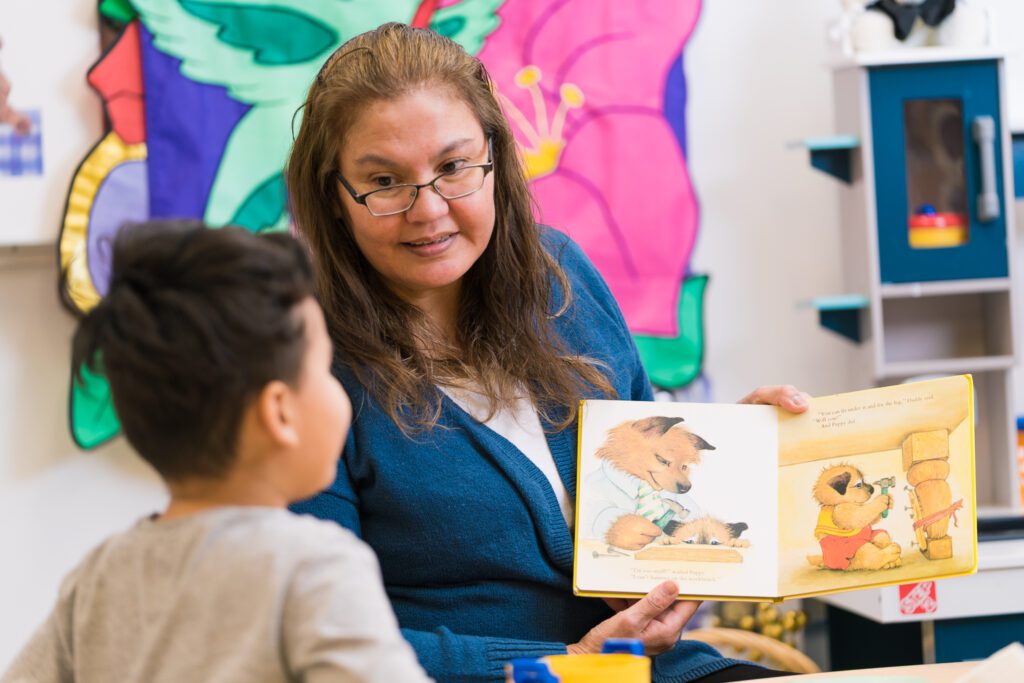 UCN ECE student with young child.